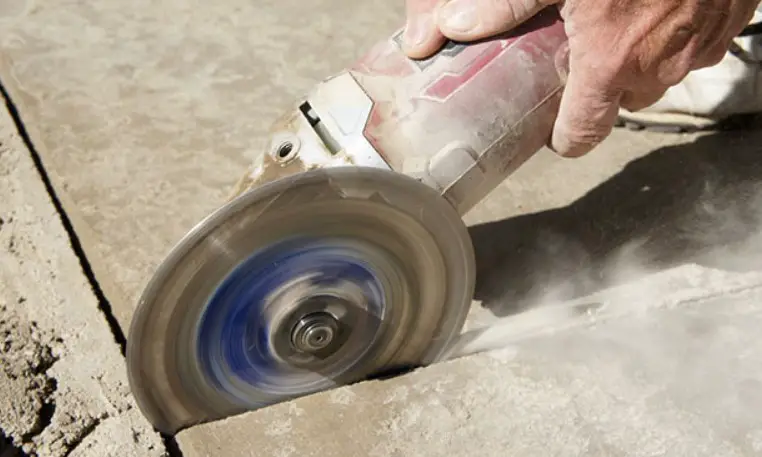 Cutting concrete by angle grinders