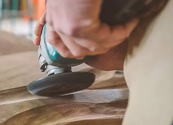 carving wood by an angle grinder